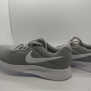 Gray and white Nikes
